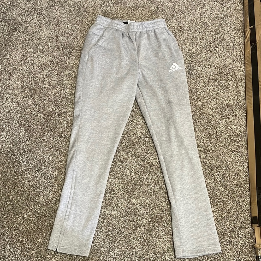 Like new gray Adidas track pants. No stains, rips or signs of wear